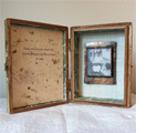 "Sweet Memories"Mixed media assemblage (4 ¼” x 5 ½” x 2”). Exterior – cigar box, walnut stain - silver label. Interior – silver leaf & laminated chenille - personal mementoes – reproduction prints