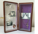 "Beautiful Mother"  Mixed media assemblage (3 ½” x 7 ½” x 2 ¼”). Exterior – cigar box, walnut stain - silver label. Interior – silver leaf & Laminated chenille - personal mementoes – reproduction printsn
